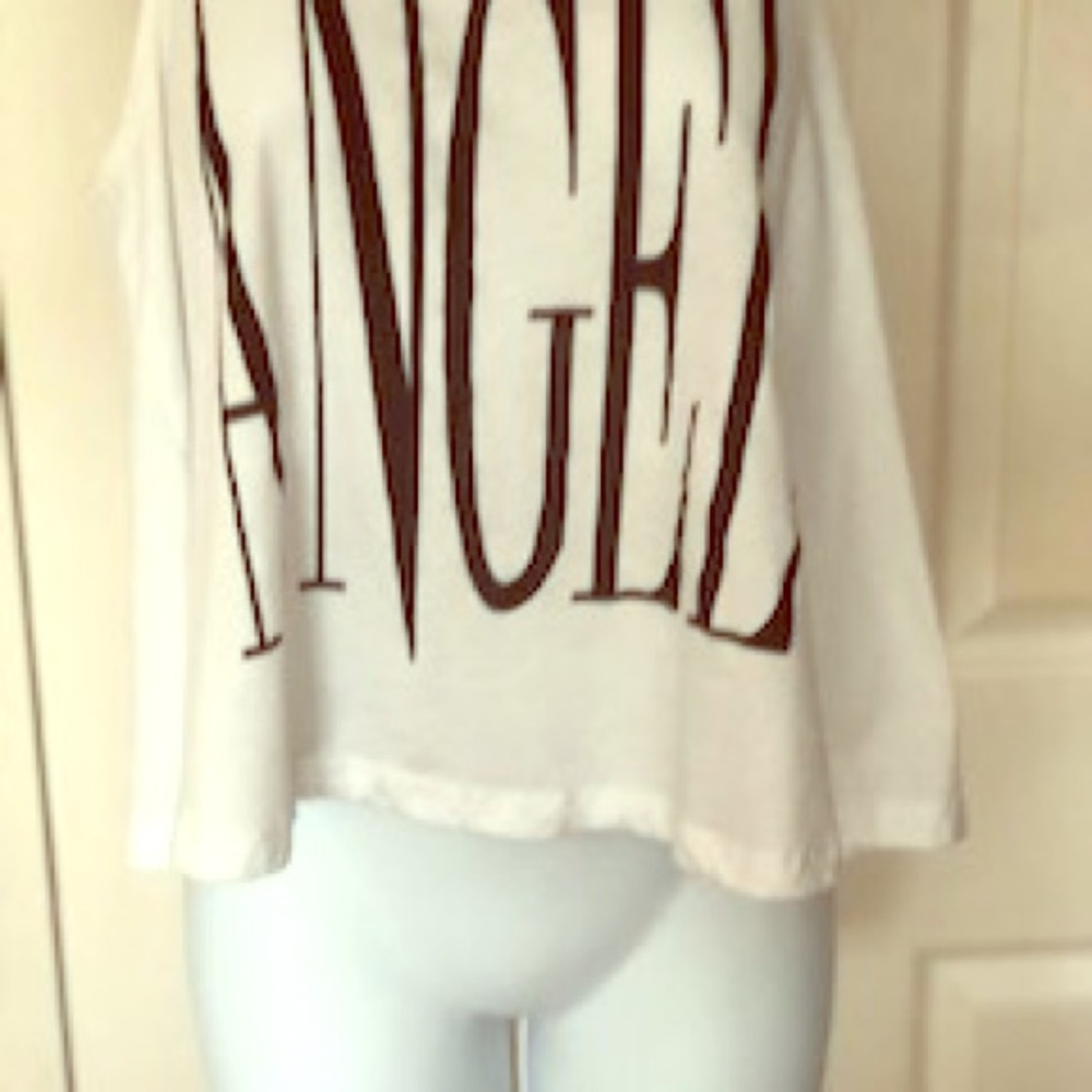 Angel graphic tank, says who ? Medium. Fly away